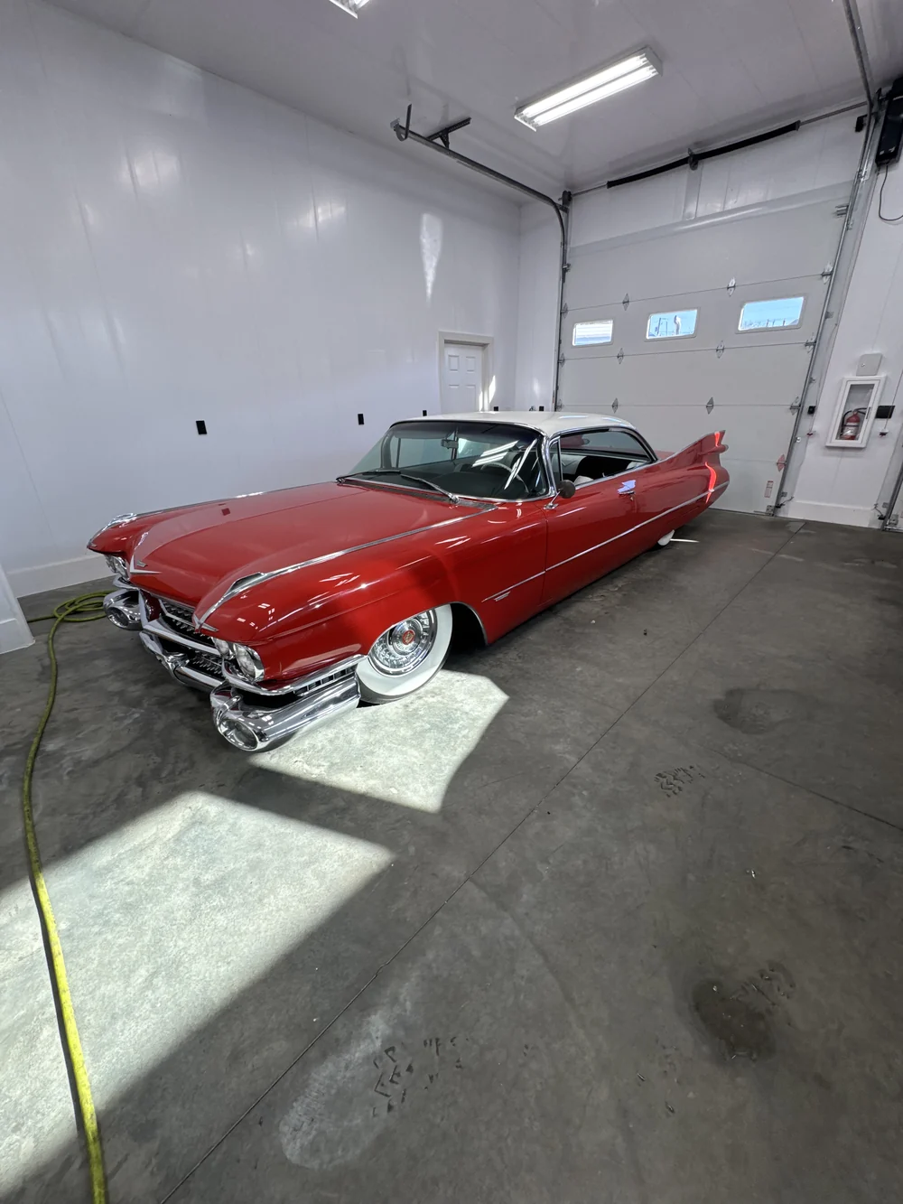 Red classic car detailed to a high-gloss finish