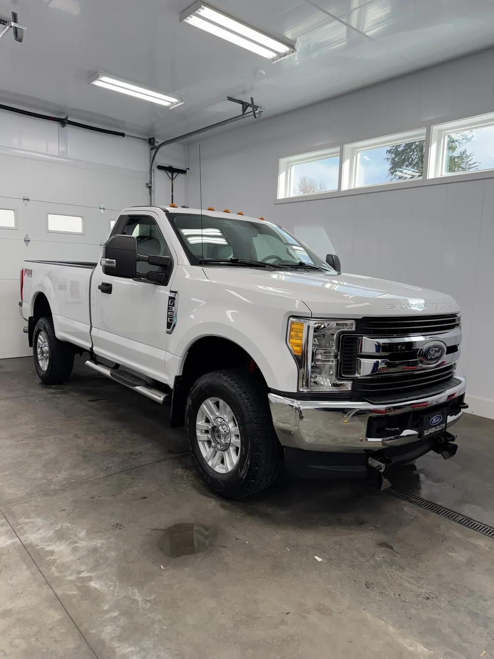 White Ford Super Duty work truck fully detailed