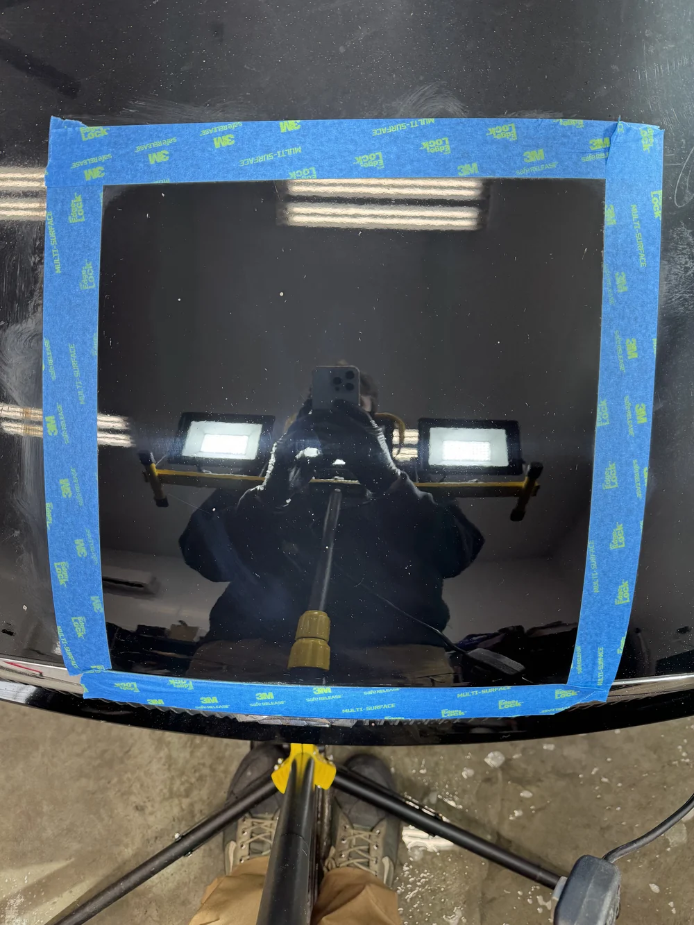 Vehicle paint after correction showing a clear mirror reflection